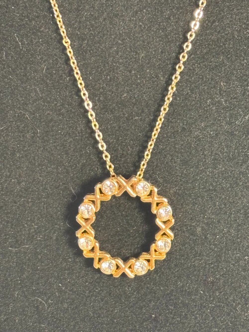 Gold Tone Eternity Circle XOXO Crystal Pendant Necklace